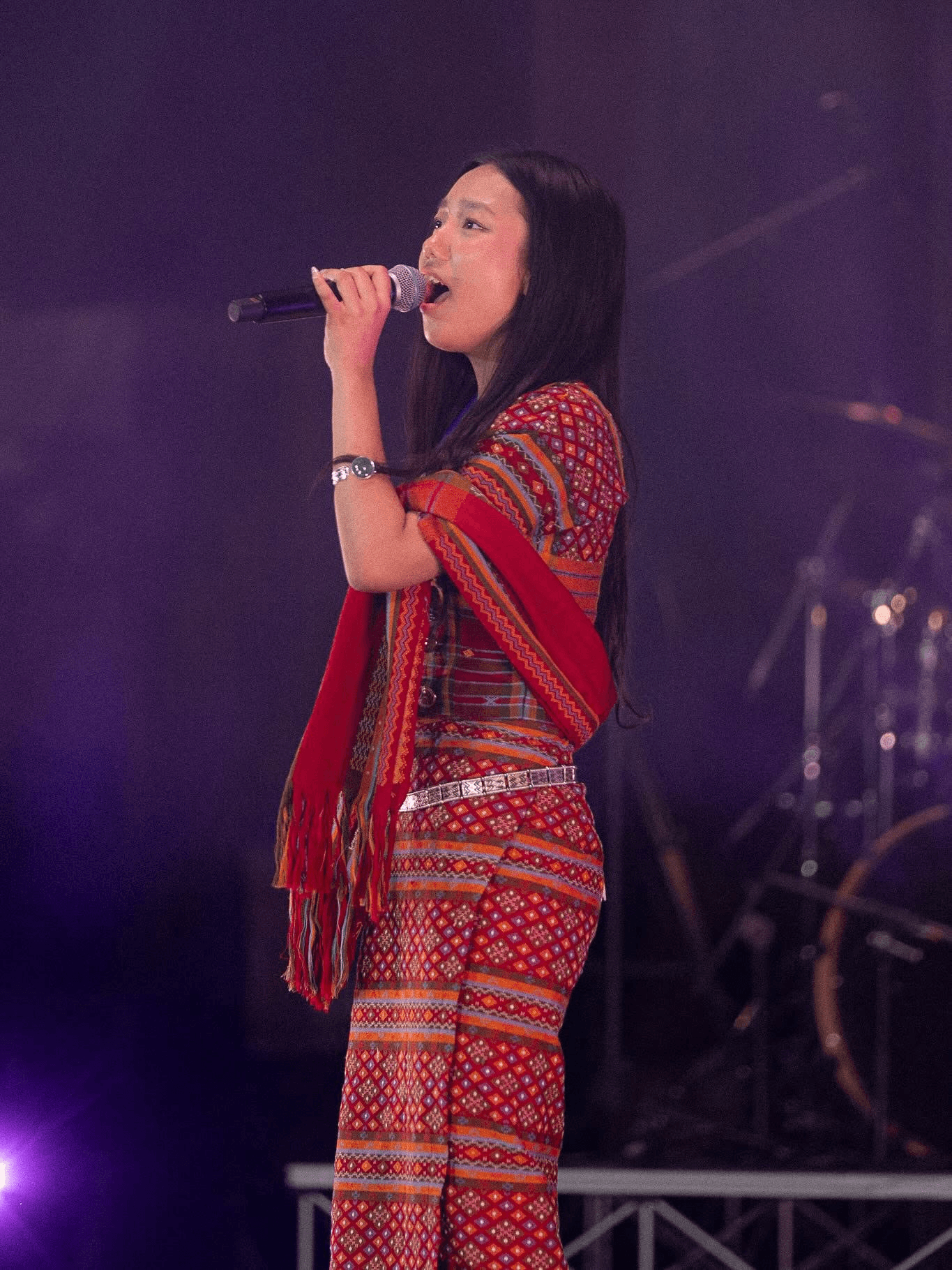 Last season's Chin American Idol winner performing on stage